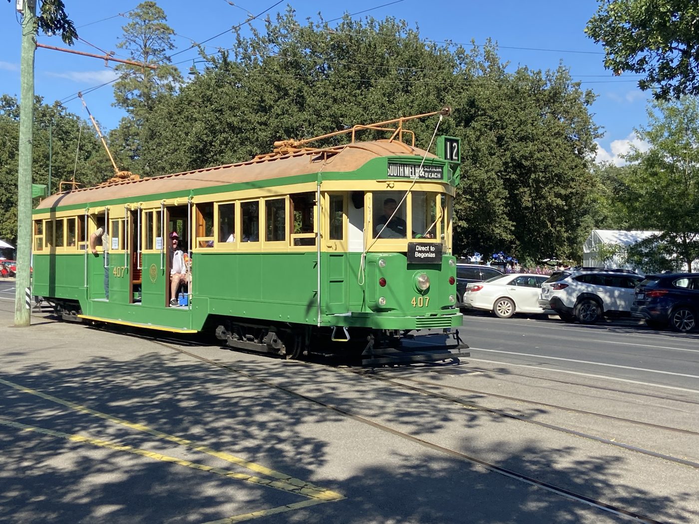 Green and cream W2 class tram number 407 running Direct to Begonias shuttles at Ballarat in March 2022